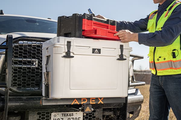 White Apex A45 cooler securely mounted to the front of a fleet vehicle