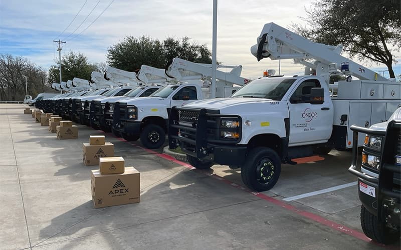 Fleet trucks with boxes of Apex Cooler parts ready to install